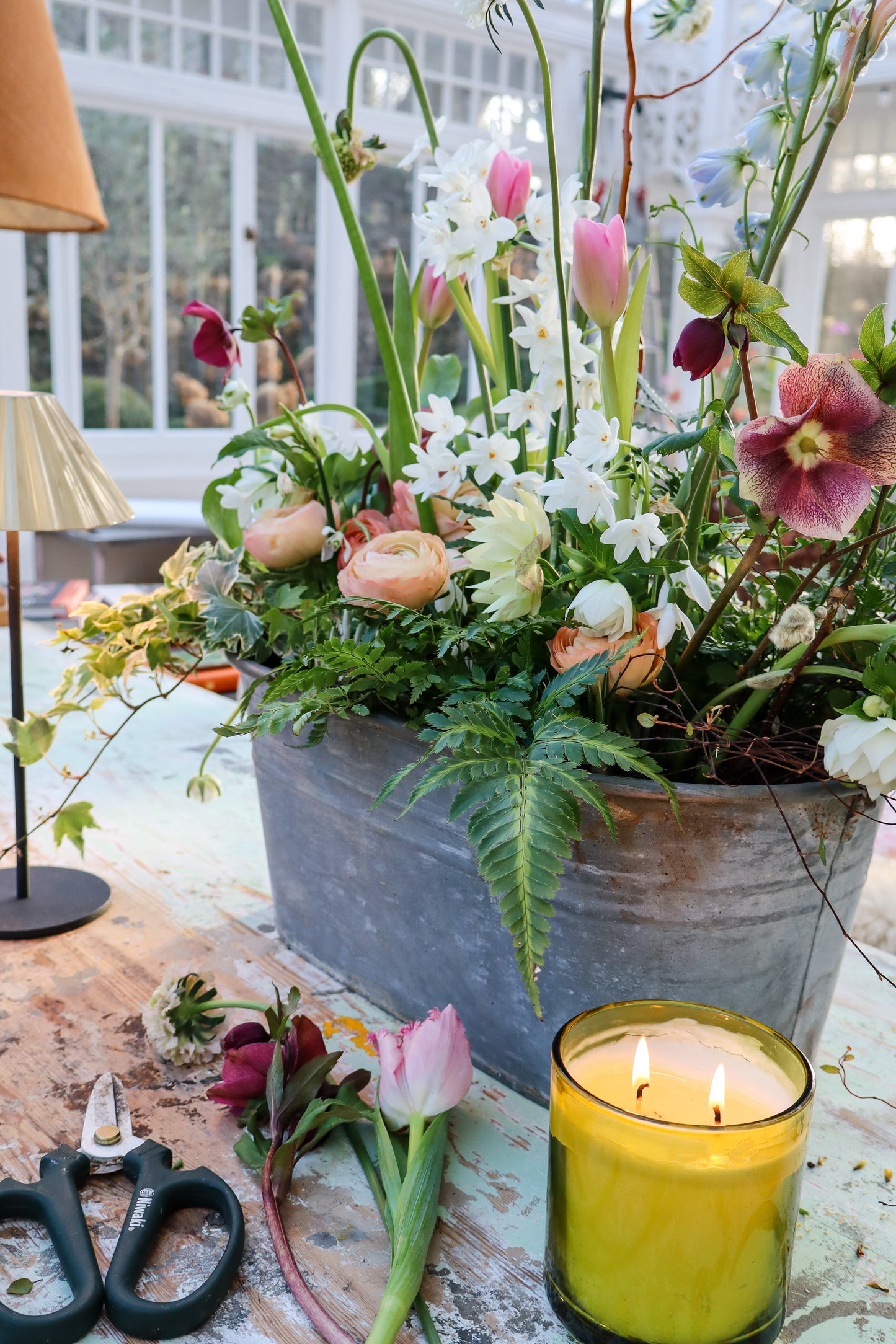 Preparing a display beside our Wild & Fabulous candle.